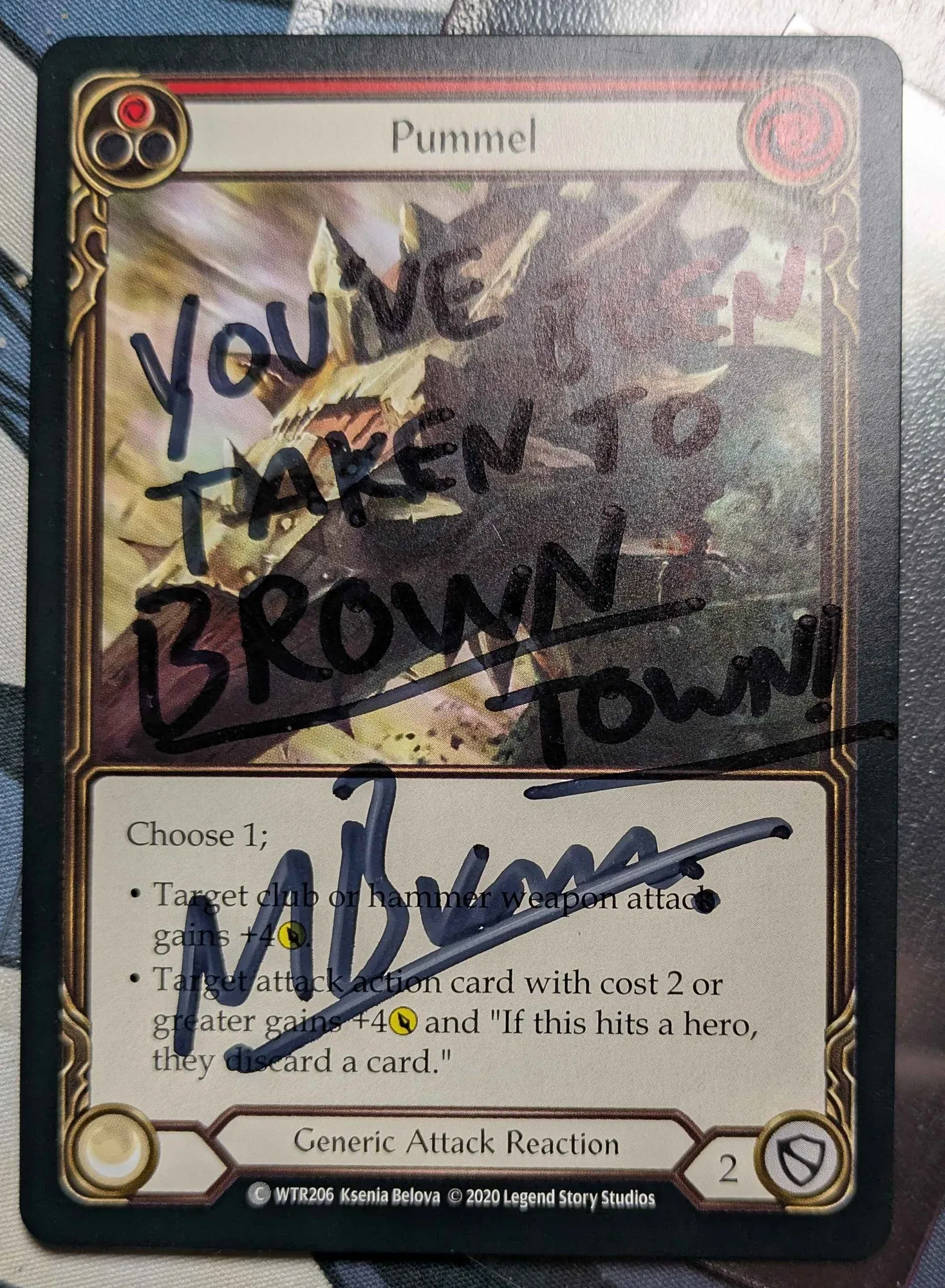 Marcus Brown signed Pummel that says "You've been taken to Brown Town"