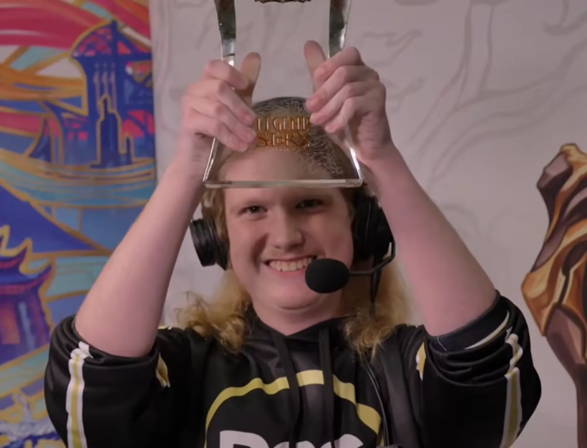 Evan Herndon holding trophy